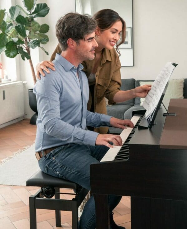 Kawai CN301 man and woman playing piano